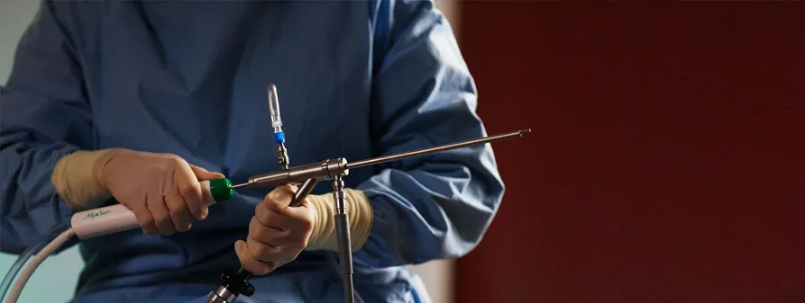 Clinician is holding a hysteroscopic device